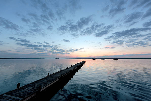 istock Jetty on lake with majestic cloudscape at sunset 96367011