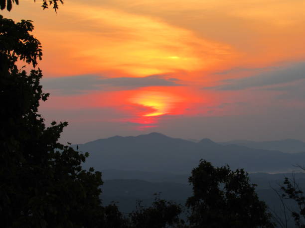 istock Red Sunrise Over Mountain Peaks And Trees 963670856