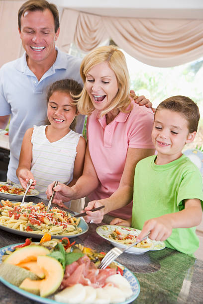istock Mother Serving Up Dinner For Family 96367364