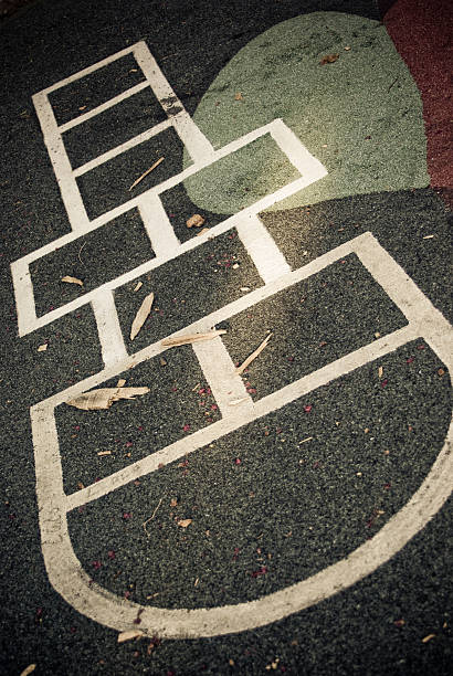 istock dark and deserted playground with hopscotch on ground 96367830