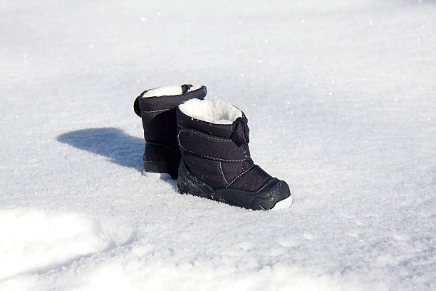 Blue kids' snowboots stock photo