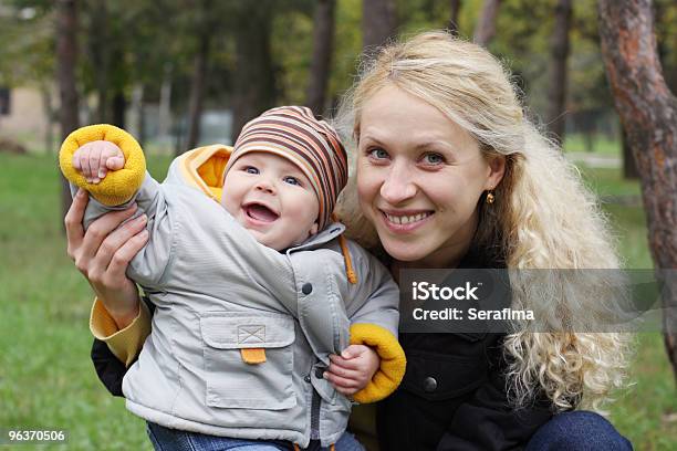 Mum With Kid In Park Stock Photo - Download Image Now - 20-29 Years, 25-29 Years, Adult