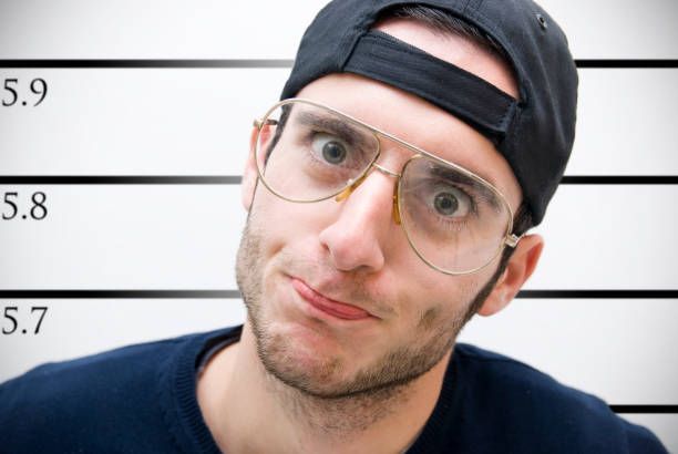 istock prisoner facing the wall for his photo identification 96370648