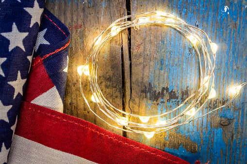 American Flag and lights on wood
