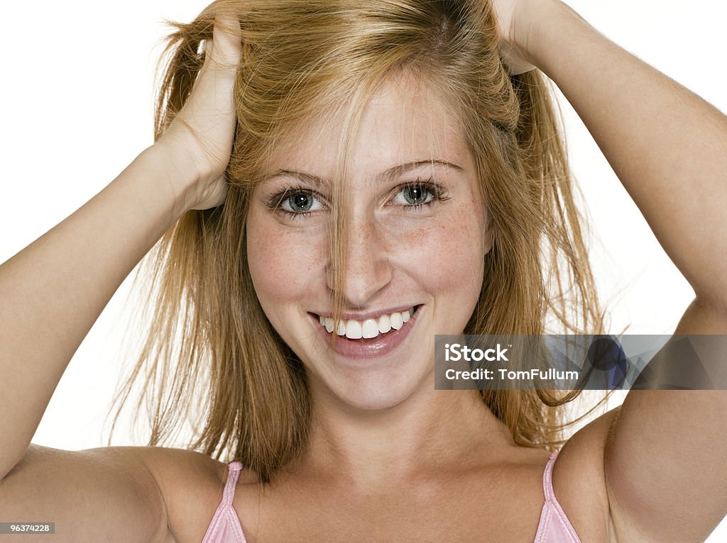 Happy Teenage Girl Playing With Hair  16-17 Years Stock Photo