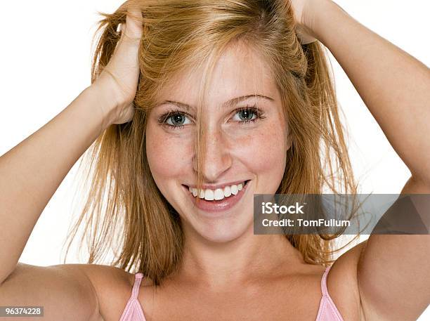 Happy Teenage Girl Playing With Hair Stock Photo - Download Image Now - 16-17 Years, Adult, Adults Only