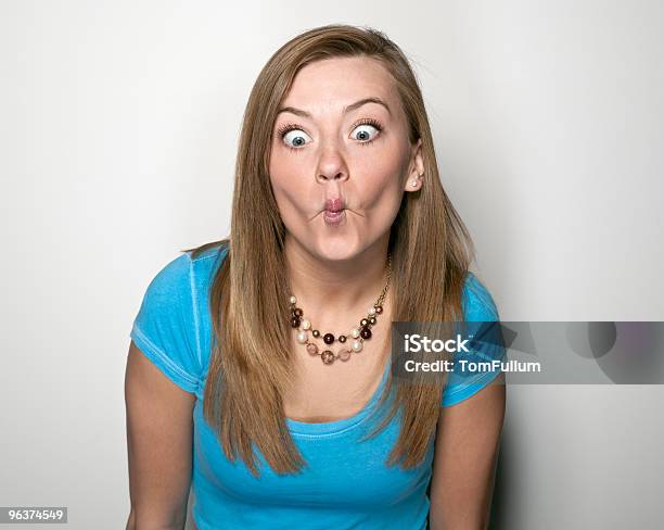 Cute Teenage Girl Making A Face Stock Photo - Download Image Now - 18-19 Years, Adult, Blond Hair