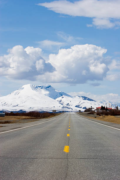 istock Road running through snowy mountains 96375306