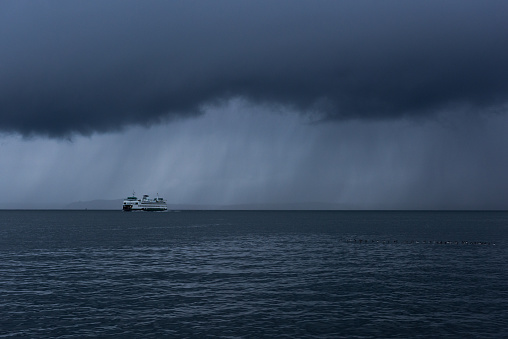 A ferry just ahead of a rain storm on Elliott Bay.