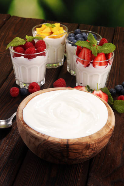 istock Yogurt and berry. Fresh fruit yogurt with fresh berries and peaches 963774968