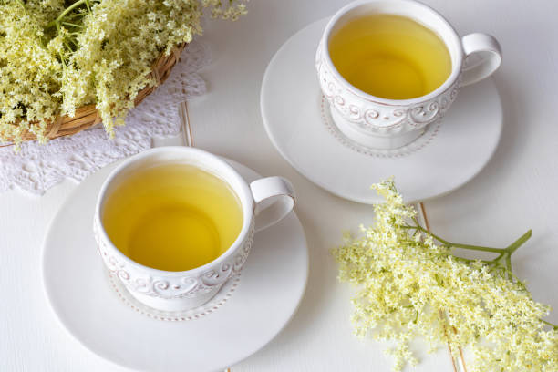 istock Two cups of elder flower tea with fresh elder flowers 963801324