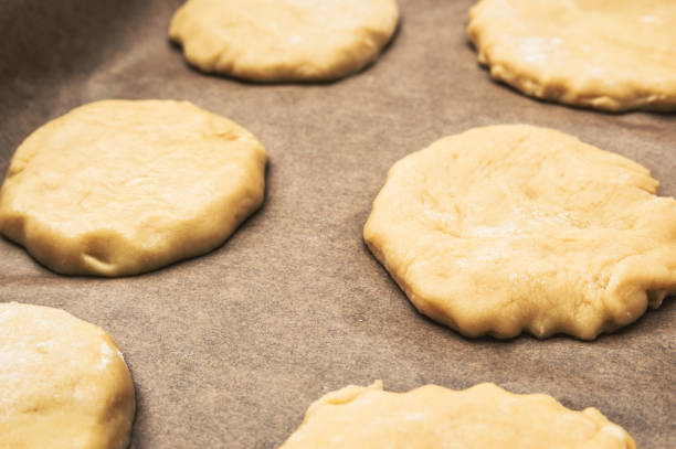 istock Home handmade baking, the dough on parchment paper 963811592