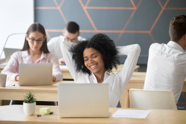 istock Happy student or employee enjoying break at workplace feeling relaxed 963814416