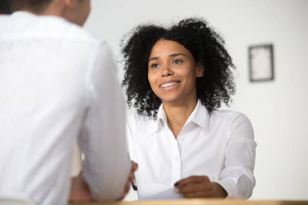istock Smiling african hr interviewing job applicant, human resources management concept 963815320