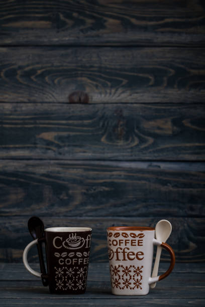 istock White, Brown Ceramic Coffee Mugs on Wooden Background 963818394