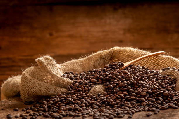 istock Sack of spilled roasted coffee beans 963821126