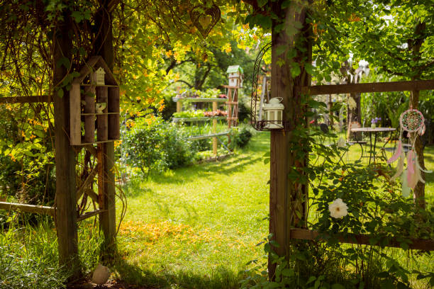 istock Arbor Gate in a beautiful green garden 963830986