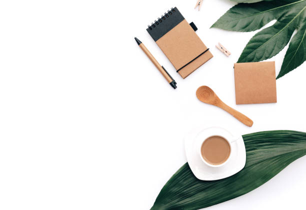 istock Flat lay coffee with eco craft items and green leaf. Minimal hipster concept, office desk 963831494