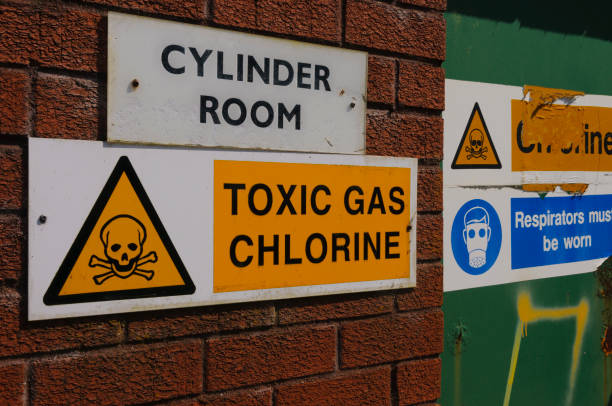 Signs warning of the presence of Chlorine gas at a water treatment plant Signs warning of the presence of Chlorine gas at a water treatment plant chlorine stock pictures, royalty-free photos & images