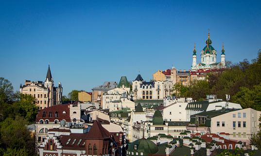 Panorama of the city of Kiev from the castle mountain. City street with colored European houses.