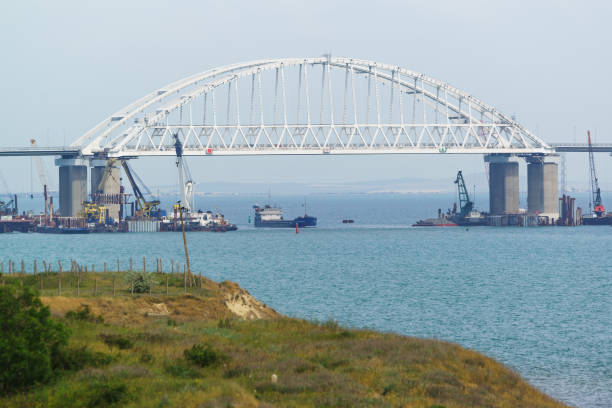 istock Shipping arch span Crimean bridge across the Kerch Strait 963841758