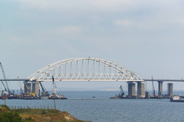 istock Arch span Crimean bridge across the Kerch Strait. Spring day 963841786