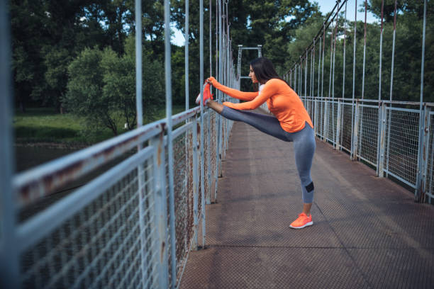 istock Fit woman stretching on the bridge 963841876