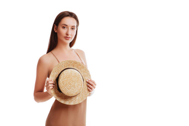 istock Woman in dress with hat, isolated. 963842624