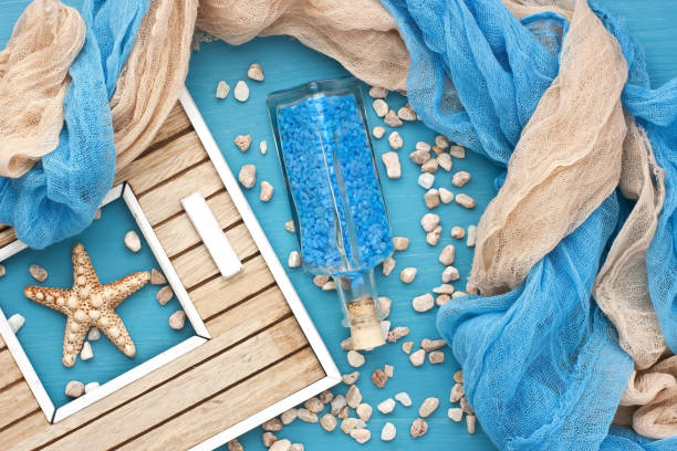 istock Marine background with  glass bottle  and seashells 963842782