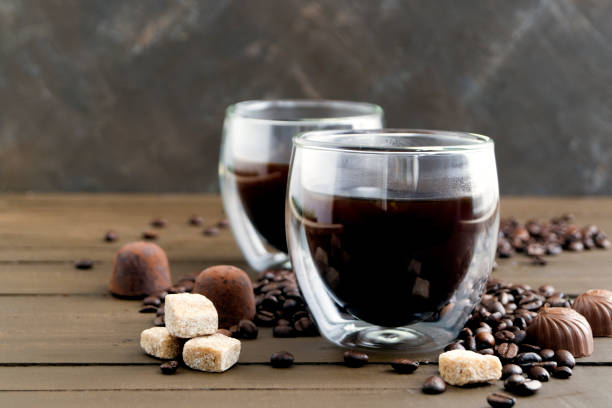 istock Coffee in double-walled glass on a wooden table. 963854846