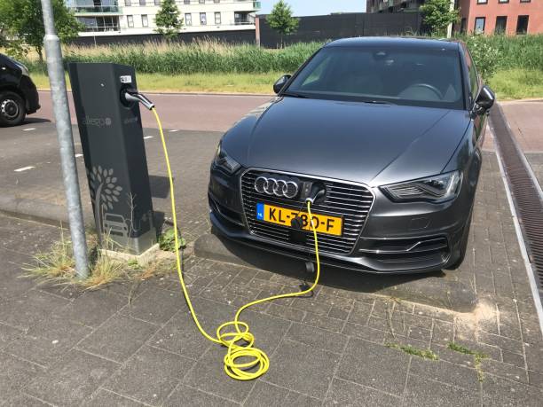 Audi A3 Sportback E-Tron electric car being charged Almere, Netherlands - May 27, 2018: Audi A3 Sportback E-Tron electric car being charged at a Allego charge point. almere photos stock pictures, royalty-free photos & images