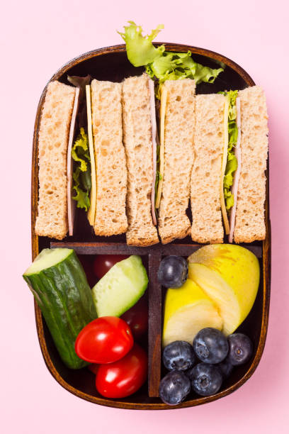 istock School wooden lunch box with sandwiches 963857488