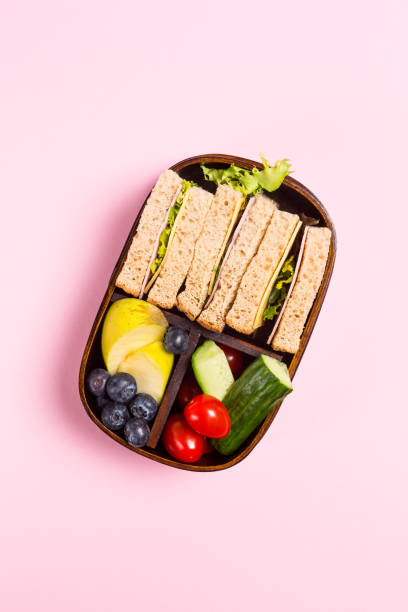 istock School wooden lunch box with sandwiches 963857500