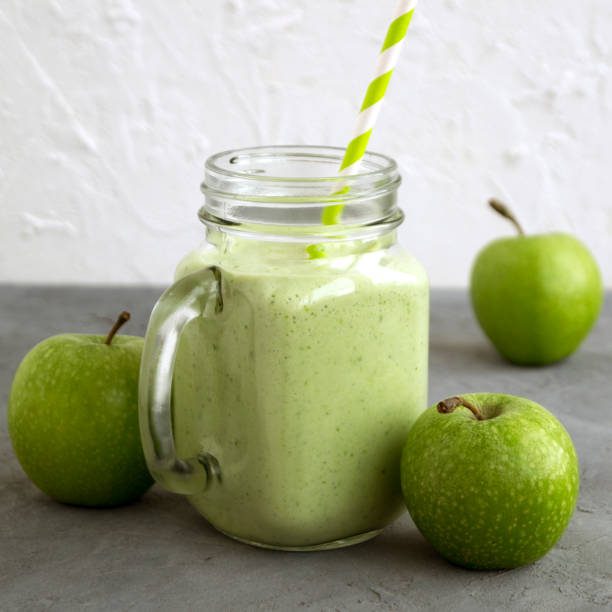 istock Healthy detox green smoothie in a mason jar. 963857726
