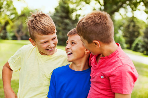 istock Three Happy Boys Outdoors 963858298