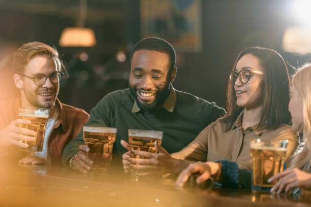 istock happy multiculture friends spending time in bar 963862458
