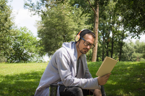 istock Good book and music is all he needs. 963868192