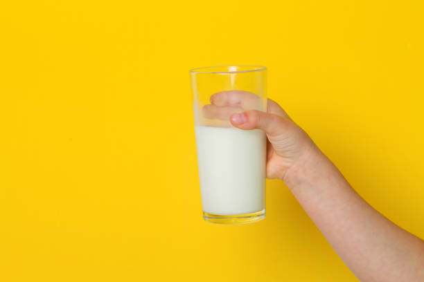 istock hand with glass of milk 963868664