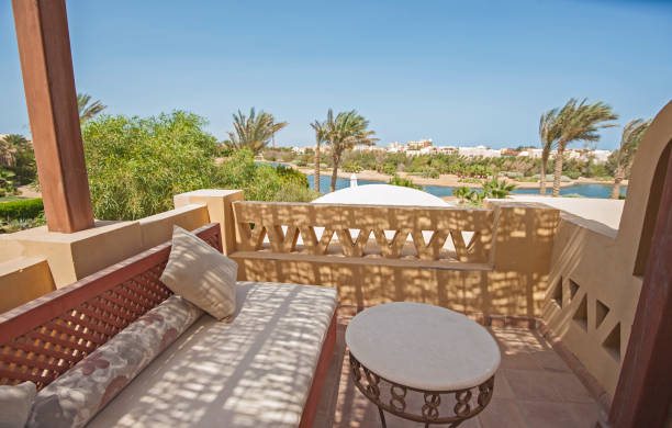 istock Terrace balcony with chairs in tropical luxury villa 963882152