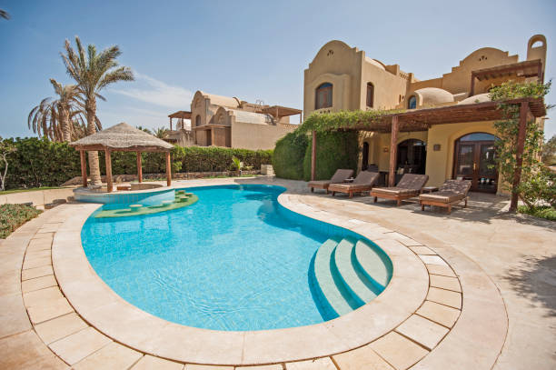 Swimming pool at at luxury tropical holiday villa resort stock photo