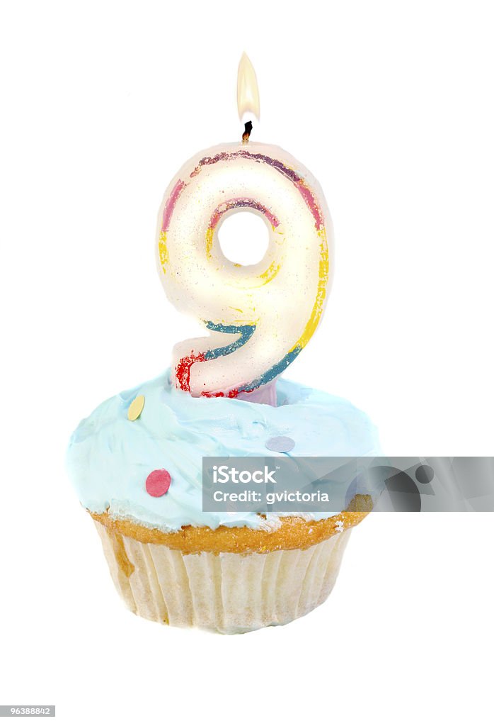 ninth  birthday ninth birthday cupcake with blue frosting on a white background Number 9 Stock Photo