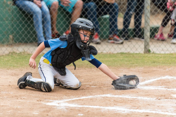 istock Digging the low pitch out of the batters box. 963893416