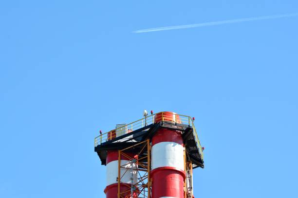 istock Modern industrial building with a high chimney 963896314