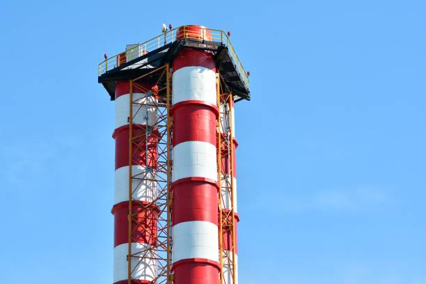 istock Modern industrial building with a high chimney 963896360