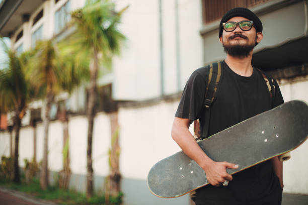 istock Guy with skateboard outdoors 963899116