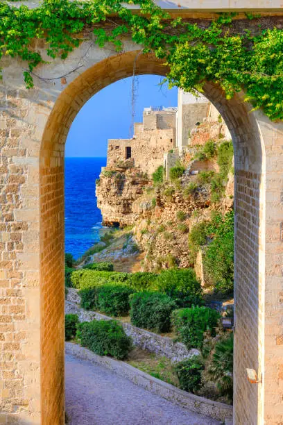 Polignano a Mare, Puglia, Italy: Ponte di Polignano bridge with Bastione di Santo Stefano and Lama Monachile beach in background, Apulia, Italy, Cala Paura gulf, province of Bari