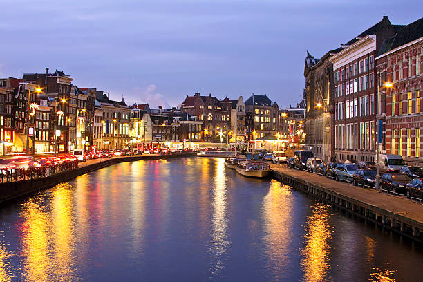 istock Amsterdam innercity at Damrak in the Netherlands by night 96390976