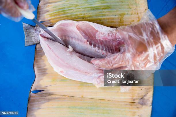 Men Selling And Preparing Grilled Fish Stock Photo - Download Image Now - 30-39 Years, Adult, Asian and Indian Ethnicities