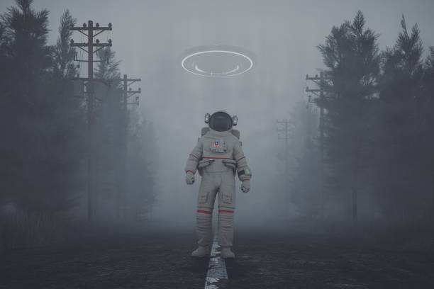 Mysterious UFO and walking astronaut on the forest road at night
