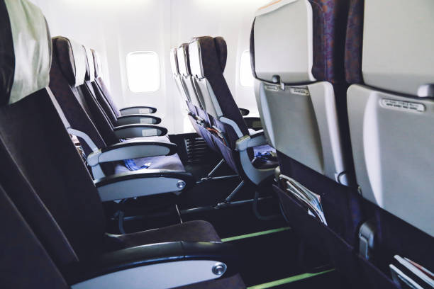 istock Empty airplane seats in the economy class cabin 963913852